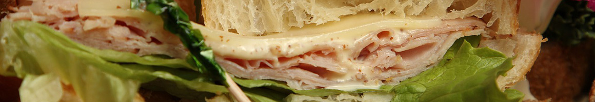 Eating Sandwich at Brine's Market & Deli restaurant in Stillwater, MN.